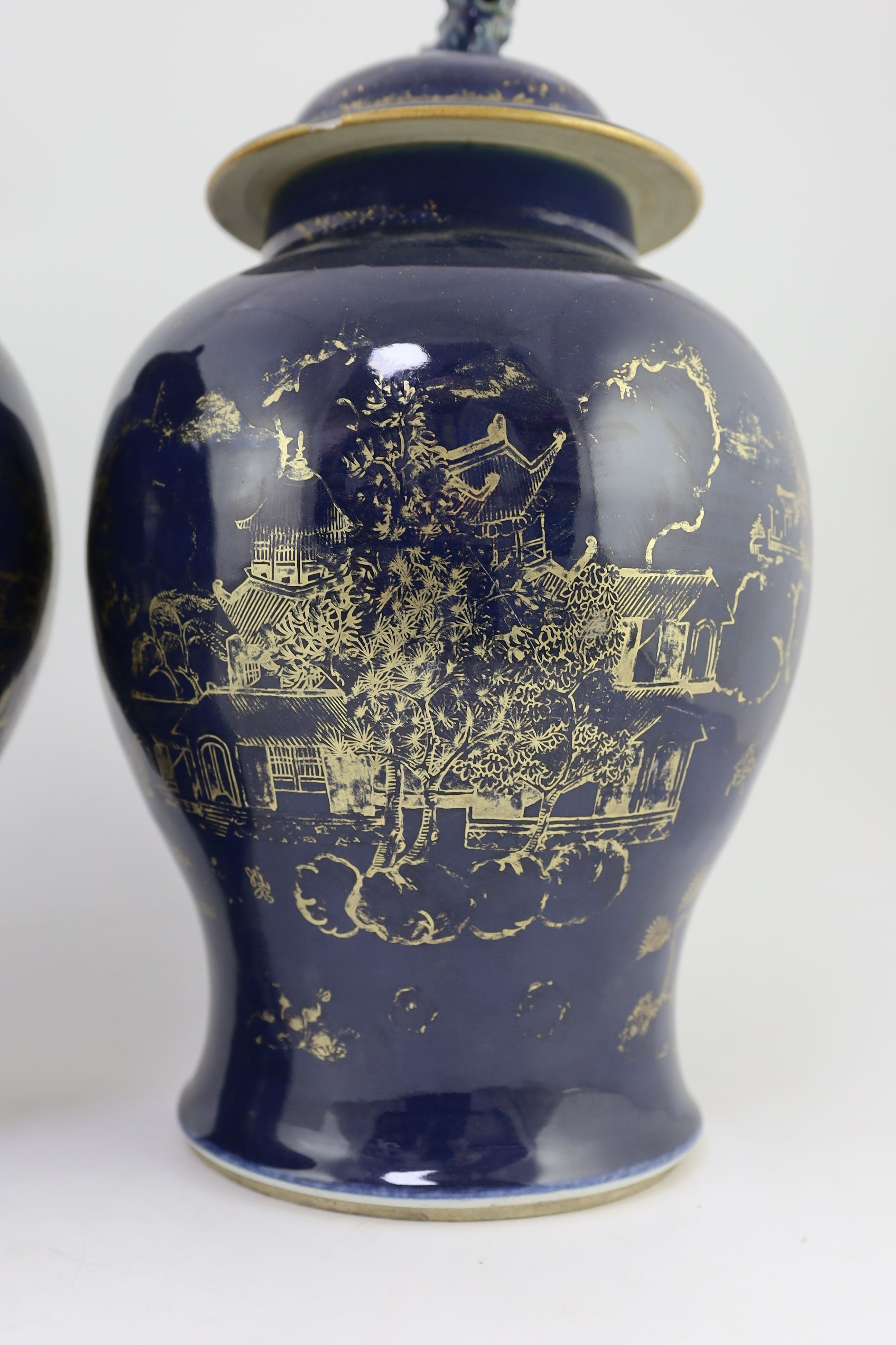 A pair of Chinese gilt-decorated blue ground baluster vases and covers, 19th century, 44 cm high